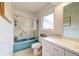 Small bathroom with a shower-tub combination and a white vanity with drawers at 502 Palm Dr, Largo, FL 33770