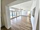 Spacious living room features tile flooring, ceiling fans, and sliding glass doors overlooking a pool at 502 Palm Dr, Largo, FL 33770