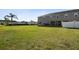 View of backyard and exterior of the home, set against a green space at 5022 Chipotle Ln, Wesley Chapel, FL 33544