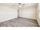 Bright bedroom features modern ceiling fan, wood-look floors and neutral paint at 5022 Chipotle Ln, Wesley Chapel, FL 33544
