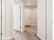 Hallway view showcasing stylish flooring and neutral colors at 5022 Chipotle Ln, Wesley Chapel, FL 33544