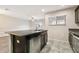 Modern kitchen features a center island, stainless steel appliances and an open floor plan at 5022 Chipotle Ln, Wesley Chapel, FL 33544