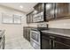 Well-equipped kitchen with stainless steel appliances, granite countertops and espresso cabinetry at 5022 Chipotle Ln, Wesley Chapel, FL 33544