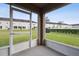 Screened-in patio offering relaxing views of the community green space at 5022 Chipotle Ln, Wesley Chapel, FL 33544