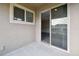 Outdoor patio showing access to the interior space through a sliding glass door at 5022 Chipotle Ln, Wesley Chapel, FL 33544