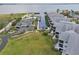 Aerial view of waterfront condos with private boat slips and lush green lawn at 515 Leffingwell Ave # 211, Ellenton, FL 34222