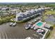 A high aerial view of waterfront condos, featuring a pool and private boat docks at 515 Leffingwell Ave # 211, Ellenton, FL 34222