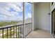 Balcony with a lake view and black metal railing with white trim at 515 Leffingwell Ave # 211, Ellenton, FL 34222