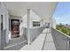 Inviting balcony view with metal railings, covered walkway and a peek of the outdoors at 515 Leffingwell Ave # 211, Ellenton, FL 34222