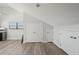 Bedroom featuring wood-look flooring, high ceilings, natural light and ample closet space at 515 Leffingwell Ave # 211, Ellenton, FL 34222