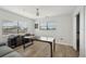 Bright bedroom with two windows, ceiling fan, wood-look floor, closet, and minimalist decor at 515 Leffingwell Ave # 211, Ellenton, FL 34222