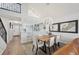 Bright and airy dining room with adjacent kitchen, living room, and staircase at 515 Leffingwell Ave # 211, Ellenton, FL 34222