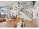 Dining area with a modern light fixture and staircase in an open concept setting at 515 Leffingwell Ave # 211, Ellenton, FL 34222