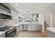 Spacious kitchen with stainless steel appliances and ample natural light at 515 Leffingwell Ave # 211, Ellenton, FL 34222