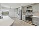 Bright kitchen featuring stainless steel appliances and ample cabinet space at 515 Leffingwell Ave # 211, Ellenton, FL 34222
