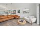 Open living room design featuring stylish furnishings and a view into the kitchen at 515 Leffingwell Ave # 211, Ellenton, FL 34222