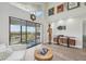 Living room showcases modern decor, balcony access, and plenty of natural light at 515 Leffingwell Ave # 211, Ellenton, FL 34222