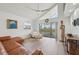 Bright living room with vaulted ceilings, modern decor, and a view of the balcony at 515 Leffingwell Ave # 211, Ellenton, FL 34222