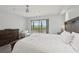 Bright main bedroom featuring a private balcony and comfortable furnishings at 515 Leffingwell Ave # 211, Ellenton, FL 34222