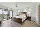 Comfortable main bedroom with a private balcony and ceiling fan at 515 Leffingwell Ave # 211, Ellenton, FL 34222