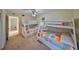Spacious bedroom featuring two bunk beds with colorful quilts, perfect for a Gathering or guests at 5155 9Th N Ave # 102, St Petersburg, FL 33710
