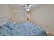 Inviting bedroom showcasing a large closet, neutral walls, and a comfortable bed with blue patterned bedding at 5155 9Th N Ave # 102, St Petersburg, FL 33710