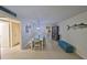 Cozy dining area with a modern table set, unique lighting, and stylish decorations for memorable gatherings at 5155 9Th N Ave # 102, St Petersburg, FL 33710