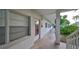 Exterior view of building entrance, showing sidewalk and minimal landscaping at 5155 9Th N Ave # 102, St Petersburg, FL 33710