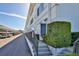 Exterior view showing entrance access and parking area with lush landscaping at 5155 9Th N Ave # 102, St Petersburg, FL 33710