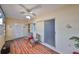 Cozy sitting area features wood floors, ceiling fan, closet, and charming decor at 5155 9Th N Ave # 102, St Petersburg, FL 33710