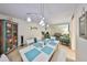 Open layout featuring dining area leading to a living room, providing a seamless flow for a comfortable living experience at 5155 9Th N Ave # 102, St Petersburg, FL 33710