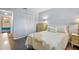 Comfortable bedroom featuring hardwood floors, closet, and a charming decor with a St Petersburg throw pillow at 5246 81 N St # 24, St Petersburg, FL 33709