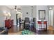 Dining area with a table and chairs, dark wood floors, and a view of the kitchen at 5246 81 N St # 24, St Petersburg, FL 33709