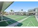 Well maintained shuffleboard court for residents, shaded benches and building at 5246 81 N St # 24, St Petersburg, FL 33709