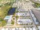 Aerial view of the community highlighting the pool, pond, and well-maintained landscaping at 5428 Larchmont N Ct # 5428, Pinellas Park, FL 33782