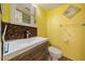 This bathroom features a mirror and a cabinet at 5428 Larchmont N Ct # 5428, Pinellas Park, FL 33782