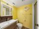 This bathroom features a mirror and a cabinet at 5428 Larchmont N Ct # 5428, Pinellas Park, FL 33782