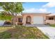 Charming single-story home featuring a well-maintained lawn and attached garage at 5428 Larchmont N Ct # 5428, Pinellas Park, FL 33782
