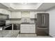 Well-lit kitchen boasting modern appliances, granite counters, and a functional layout at 5428 Larchmont N Ct # 5428, Pinellas Park, FL 33782