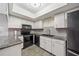 Modern kitchen with stainless steel appliances, granite countertops, and an overhead skylight at 5428 Larchmont N Ct # 5428, Pinellas Park, FL 33782