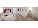 Bright bedroom featuring two beds, modern decor, and plenty of natural light at 559 Scotland St, Dunedin, FL 34698