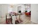 Open dining room with bright lighting and view into sitting area at 559 Scotland St, Dunedin, FL 34698