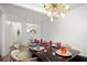 Bright dining room featuring modern light fixture and table setting at 559 Scotland St, Dunedin, FL 34698
