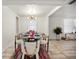 Well-lit dining room with colorful rug, and accents, enhanced by natural light at 559 Scotland St, Dunedin, FL 34698