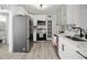 Well-equipped kitchen featuring modern appliances, ample counter space, and white cabinetry at 559 Scotland St, Dunedin, FL 34698