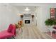 Cozy living room featuring a modern fireplace and comfortable seating at 559 Scotland St, Dunedin, FL 34698