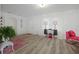 Inviting living room with hardwood floors, contemporary decor, a decorative fireplace and ample natural light at 559 Scotland St, Dunedin, FL 34698