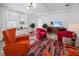 Bright living room with colorful furniture and decor, enhanced by natural light at 559 Scotland St, Dunedin, FL 34698