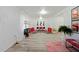 Open-concept living room with contemporary furniture, artwork, and bright ambiance at 559 Scotland St, Dunedin, FL 34698