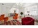 Bright living room with stylish furniture, light wood floors and lots of natural light at 559 Scotland St, Dunedin, FL 34698